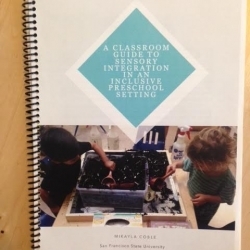 Preschool setting handbook with a student art project on the cover